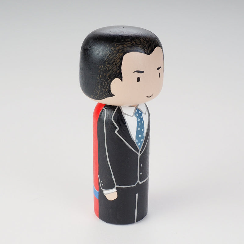 Custom super dad Kokeshi doll!  Introducing our new 2 in 1 family portrait Kokeshi dolls! 2 Designs of the same person hand-painted in 1 doll. Everyone has many roles, interests, careers, personalities, and we all wear many hats in life. Why not highlight and celebrate those in a hand-painted doll! 1 design on one side, turn the doll around and it shows another design. The toughest part is probably to choose the 2 roles you like us to paint.