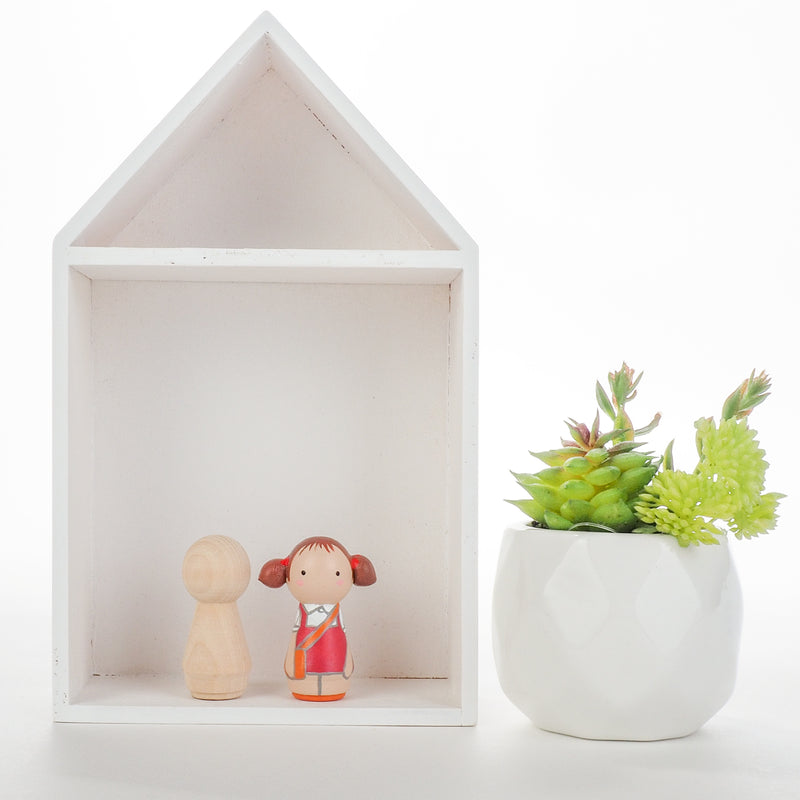 Give something unique and personalized.  Custom peg dolls of your family!  They are hand-painted that show the uniqueness of each individual in your family.  This will definitely touch the heart and bring smiles, may be even happy tears to your family.