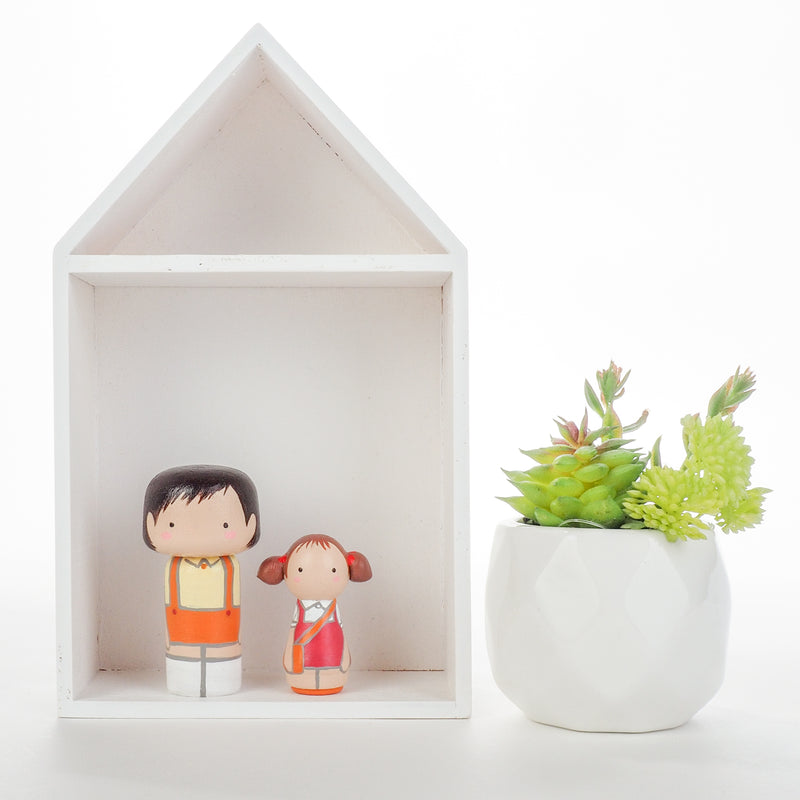 Give something unique and personalized.  Custom peg dolls of your family!  They are hand-painted that show the uniqueness of each individual in your family.  This will definitely touch the heart and bring smiles, may be even happy tears to your family.