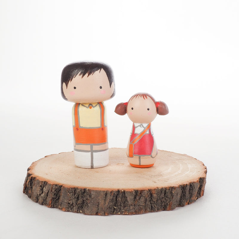 Give something unique and personalized.  Custom peg dolls of your family!  They are hand-painted that show the uniqueness of each individual in your family.  This will definitely touch the heart and bring smiles, may be even happy tears to your family.
