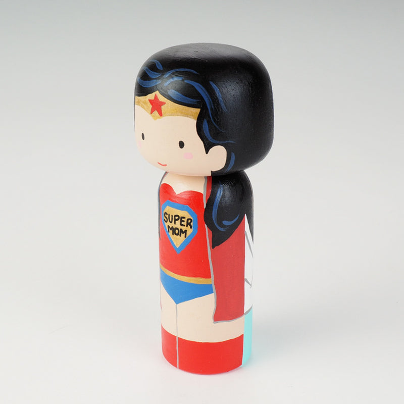Custom super mom doll! Introducing our new 2 in 1 family portrait Kokeshi dolls! 2 Designs of the same person hand-painted in 1 doll. Everyone has many roles, interests, careers, personalities, and we all wear many hats in life. Why not highlight and celebrate those in a hand-painted doll! 1 design on one side, turn the doll around and it shows another design. The toughest part is probably to choose the 2 roles you like us to paint.