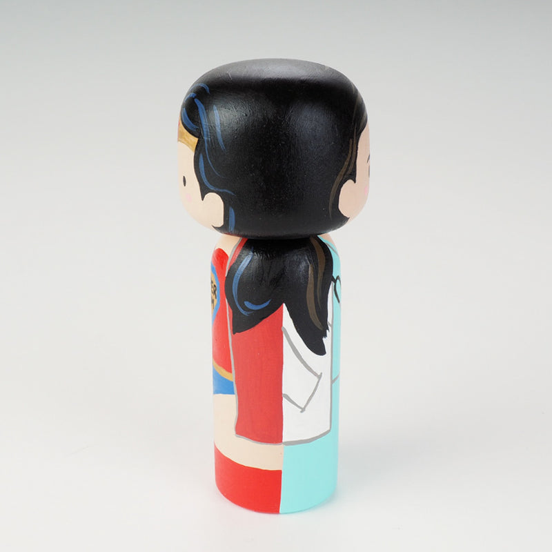 Custom super mom doll! Introducing our new 2 in 1 family portrait Kokeshi dolls! 2 Designs of the same person hand-painted in 1 doll. Everyone has many roles, interests, careers, personalities, and we all wear many hats in life. Why not highlight and celebrate those in a hand-painted doll! 1 design on one side, turn the doll around and it shows another design. The toughest part is probably to choose the 2 roles you like us to paint.