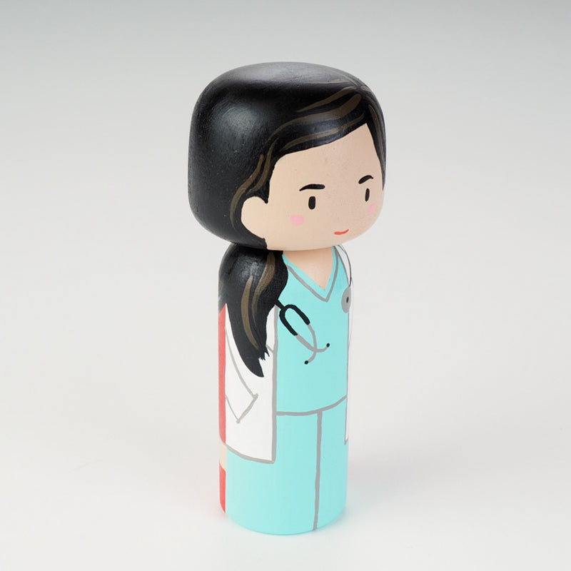 Custom super mom doll! Introducing our new 2 in 1 family portrait Kokeshi dolls! 2 Designs of the same person hand-painted in 1 doll. Everyone has many roles, interests, careers, personalities, and we all wear many hats in life. Why not highlight and celebrate those in a hand-painted doll! 1 design on one side, turn the doll around and it shows another design. The toughest part is probably to choose the 2 roles you like us to paint.