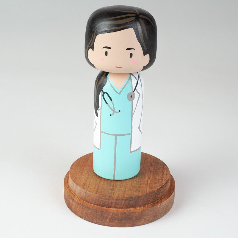 Custom super mom doll! Introducing our new 2 in 1 family portrait Kokeshi dolls! 2 Designs of the same person hand-painted in 1 doll. Everyone has many roles, interests, careers, personalities, and we all wear many hats in life. Why not highlight and celebrate those in a hand-painted doll! 1 design on one side, turn the doll around and it shows another design. The toughest part is probably to choose the 2 roles you like us to paint.