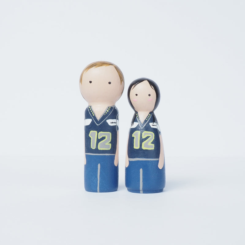 Give something unique and personalized. Custom peg dolls of your family! They are hand-painted that show the uniqueness of each individual in your family. A 9"x9" white shadow frame is included with the city landscape of your hometown! This will definitely touch the heart and bring smiles, may be even happy tears of your loved ones.  These are great for parents, grandparent’s gifts, birthdays, anniversary gifts, couples’ gifts, or any other occasions.