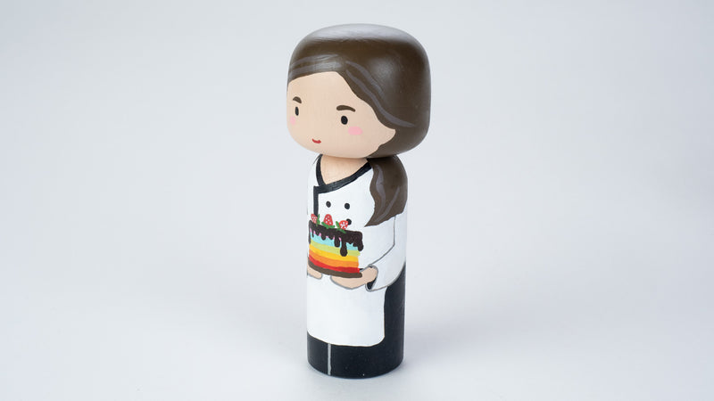 Baker - Hobby and occupational Kokeshi Doll.  Introducing our new hobby and occupational Kokeshi dolls!  Give something unique and personalized.  Customize a hobby or occupation of your family, friends, or colleagues on Kokeshi dolls!  They are hand-painted with love that show the uniqueness of each individual. 