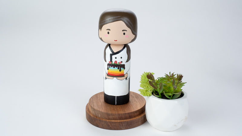Baker - Hobby and occupational Kokeshi Doll.  Introducing our new hobby and occupational Kokeshi dolls!  Give something unique and personalized.  Customize a hobby or occupation of your family, friends, or colleagues on Kokeshi dolls!  They are hand-painted with love that show the uniqueness of each individual. 