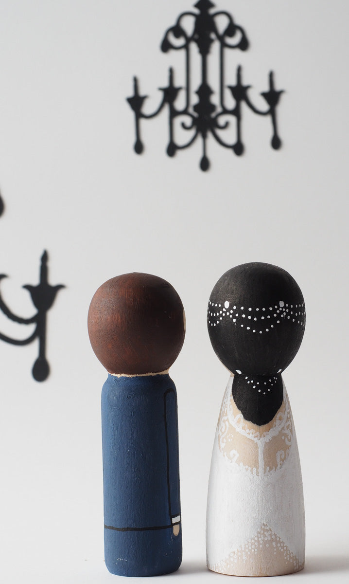 Customized wedding cake topper!  These cute peg dolls show the unique sides of you and your partner.  A great touch of personality to your wedding.  They will WOW your guests.  Also, what a great keepsake it would be!