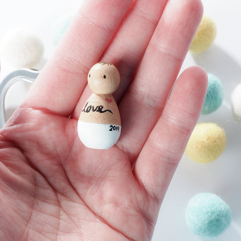 This custom baby peg doll is designed to bring comfort to parents who are grieving miscarriage and losses. 