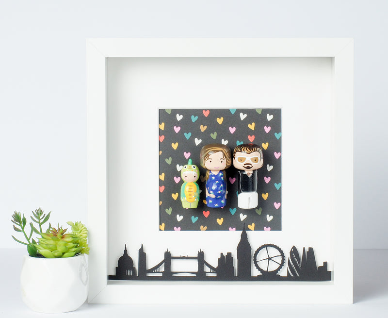Give something unique and personalized. Custom peg dolls of your family! They are hand-painted that show the uniqueness of each individual in your family. A white shadow frame is included with the city landscape of your hometown! This will definitely touch the heart and bring smiles, may be even happy tears of your loved ones.  These are great for parents, grandparent’s gifts, birthdays, anniversary gifts, couples’ gifts, or any other occasions.