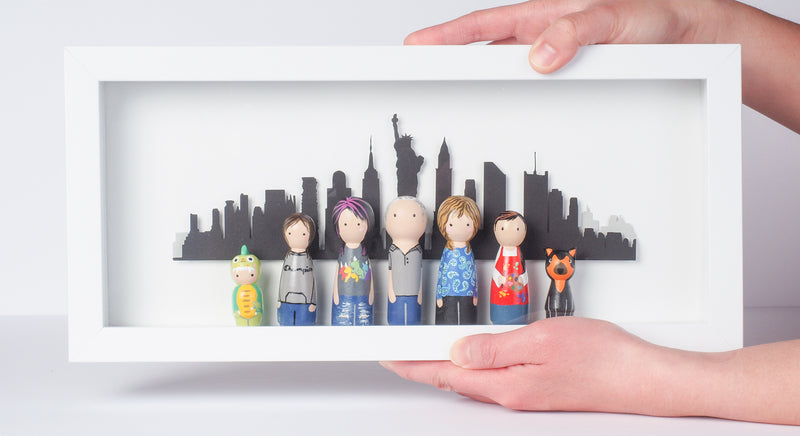 Give something unique and personalized. Custom peg dolls of your family! They are hand-painted that show the uniqueness of each individual in your family. A white shadow frame is included with the city landscape of your hometown! This will definitely touch the heart and bring smiles, may be even happy tears of your loved ones.  These are great for parents, grandparent’s gifts, birthdays, anniversary gifts, couples’ gifts, or any other occasions.