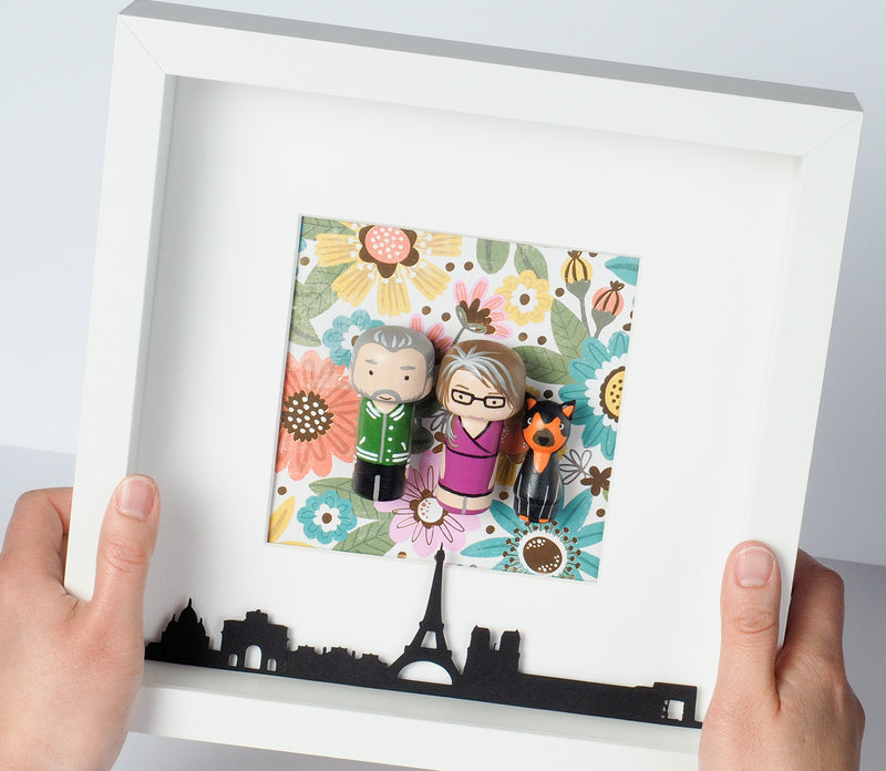 Give something unique and personalized. Custom peg dolls of your family! They are hand-painted that show the uniqueness of each individual in your family. A white shadow frame is included with the city landscape of your hometown! This will definitely touch the heart and bring smiles, may be even happy tears of your loved ones.  These are great for parents, grandparent’s gifts, birthdays, anniversary gifts, couples’ gifts, or any other occasions.